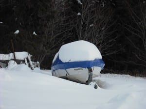 Shrink wrapping boats in snow
