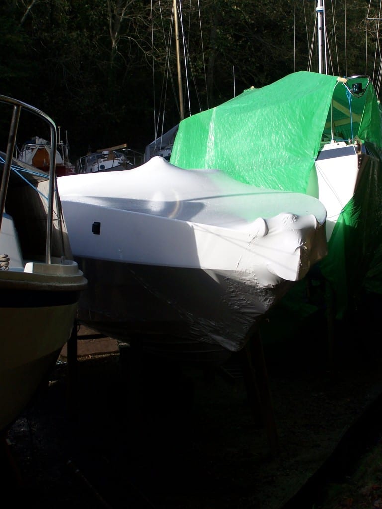 Shrink wrap or tarpaulin