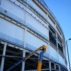 shrink wrap construction screens installed to protect the site from weather factors and debris