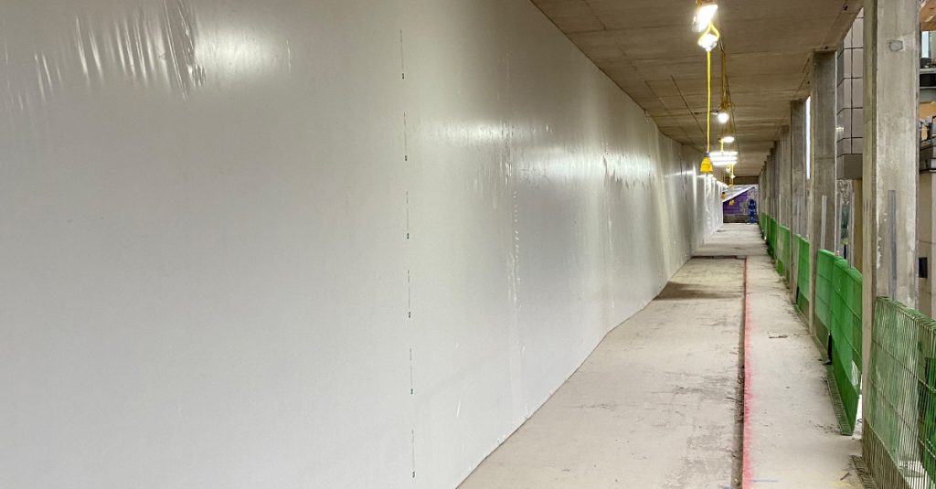 shrink wrap installation at Oxford Universitys life and mind building. shrink‑wrap construction screens